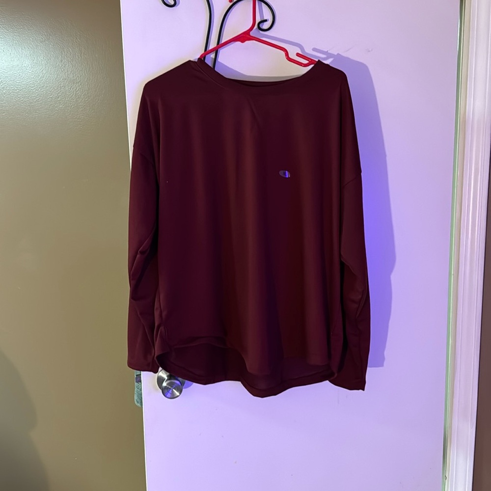 Burgundy long sleeve shirt.